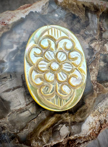 carved mother of pearl pendant